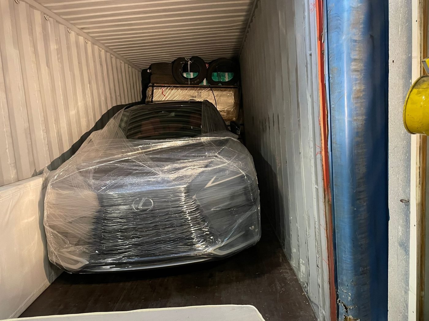 A vehicle secured inside a container